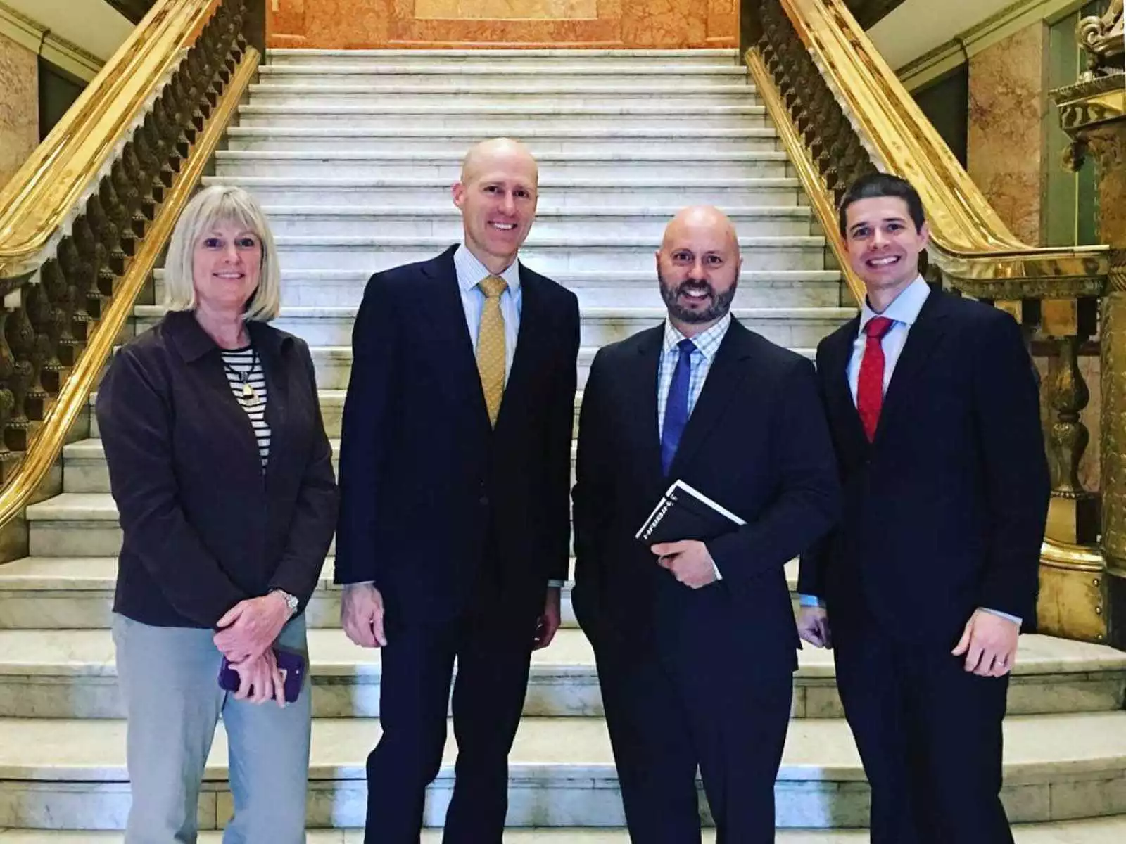 PeopleForBikes team celebrates e-bike law passage in front of Colorado capitol in Denver